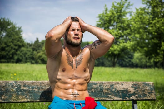 Muscular Shirtless Hunk Man Outdoor in City Park