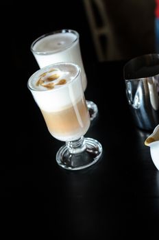 Barista making coffee latte