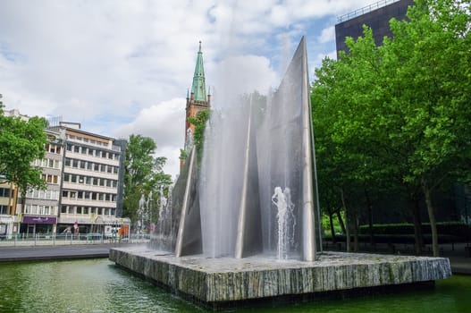 Fountain in German Reunification Memorial Square and Protestant 