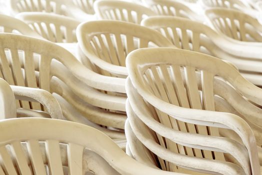 Stacked plastic chairs