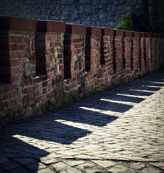 old defensive brick wall with shadow