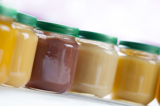 healthy ready-made baby food on a wooden table
