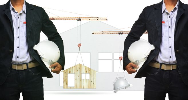 architect and construction crane lifting home and safety helmet 