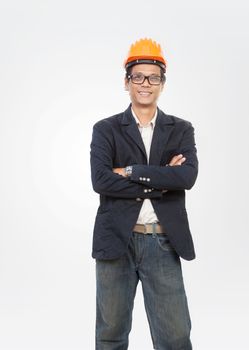 portrait of young engineer man standing with smiling face isolat