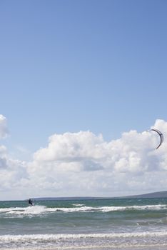 extreme kite surfer on waves