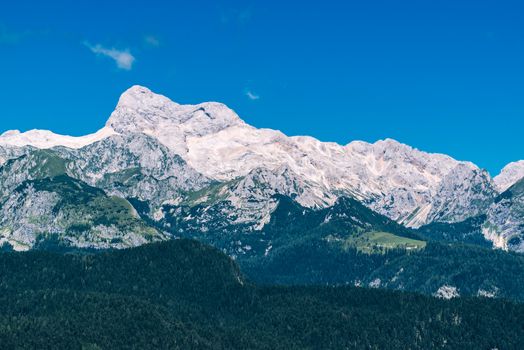 Triglav mountain peak in Slovenia national park on bright sunny day
