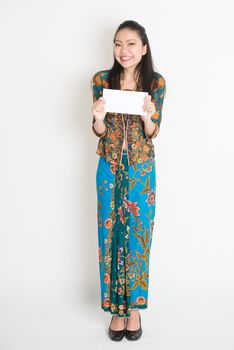 Southeast Asian girl hand holding a white paper card