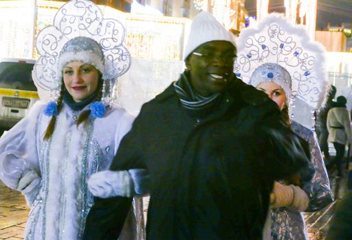 Russia Moscow in December 2016. Maiden is ready to be photographed with a male African