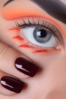 Eye makeup and manicure.