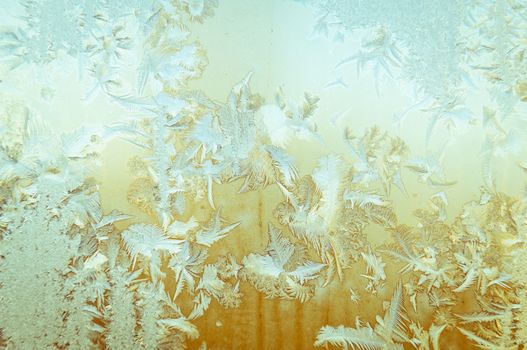 Beautiful frosty natural pattern on window glass