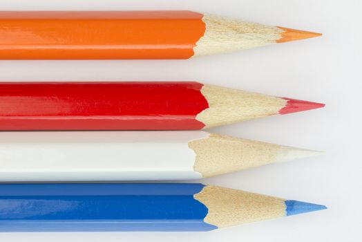 Collection of colorfull pencils in the colors of the Dutch flag as a background picture
