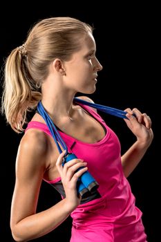 Sportswoman with skipping rope on neck