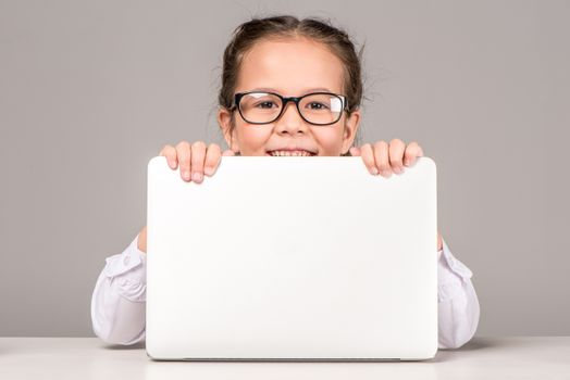 Schoolgirl holding laptop