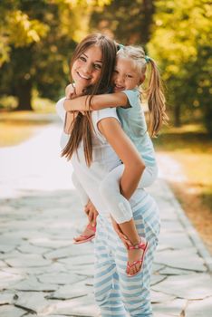 Cute Little Girl And Her Mom