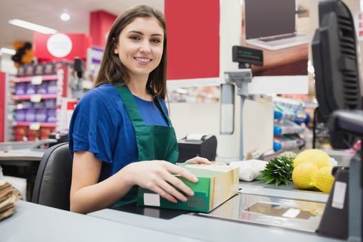 Portrait of woman cashier smiling 
