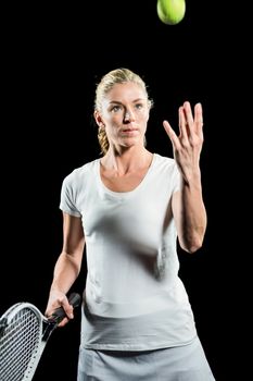 Tennis player holding a racquet ready to serve 