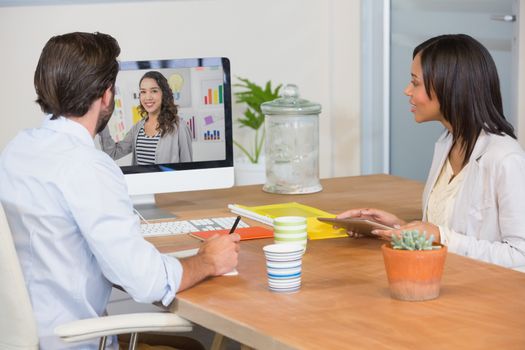 Two colleagues having a video conference