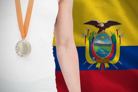 Composite image of female athlete wearing a medal