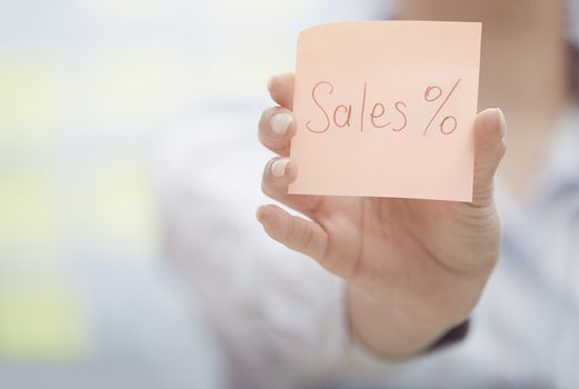 Sales text on adhesive note