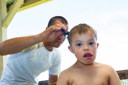 Little Boy With Downs Syndrome Getting His Haircut