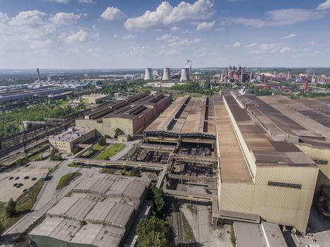 Steel factory with smokestacks at sunny day.Metallurgical plant.