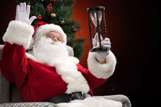 Santa Claus showing hourglass 