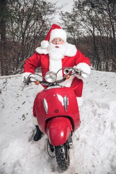 Santa Claus riding on scooter