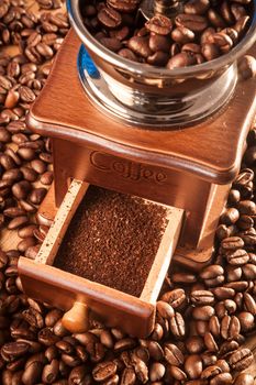 Vintage manual coffee grinder with coffee beans