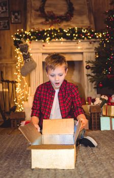 Boy opening christmas present 