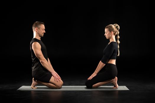 Couple pacticing yoga