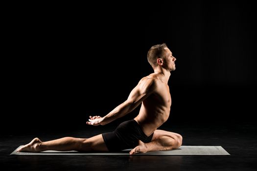Man sitting in yoga position