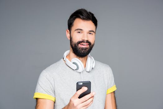 Bearded man using smartphone  