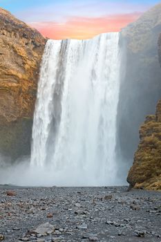 Waterfall Skogafoss in Iceland at sunset