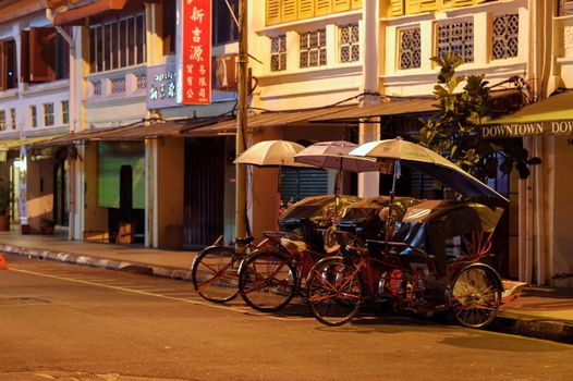 Georgetown, Penang, Malaysia - April 18, 2015: Classic local rickshaws in George Town, Penang in Malaysia