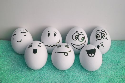 Eggs are cheerful with a face. Seven pieces