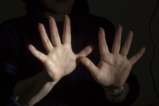 Female hands showing ten fingers 