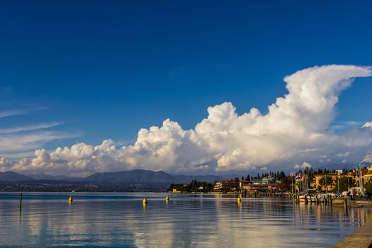 A placid lake reflecting clouds, Lake Garda