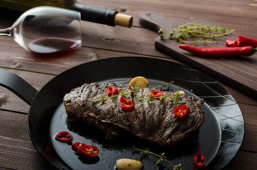 Beef steak with herbs and chilli, product photo