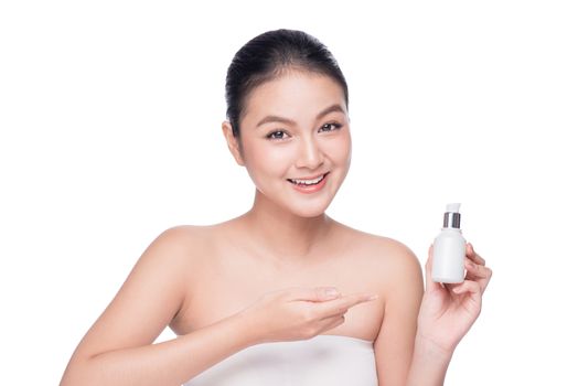 Beauty treatment. Asian woman holding serum treatment bottle