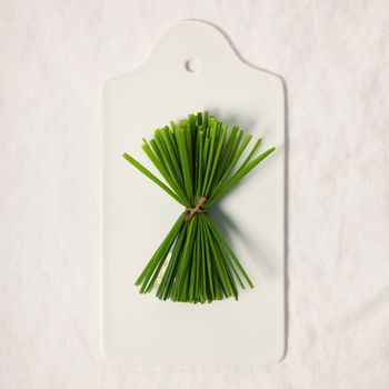 Chives on cutting board