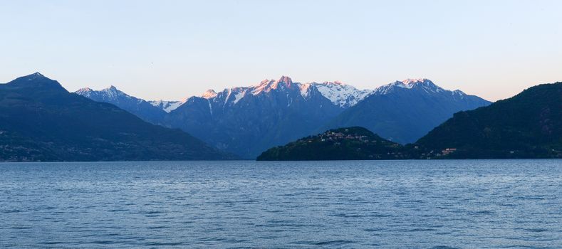 Panorama of the Lake of Como from the Beach at evening sunlight