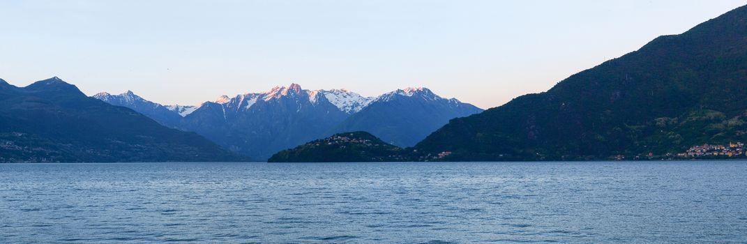 Panorama of the Lake of Como from the Beach at evening sunlight