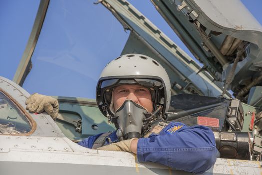 Military pilot in the cockpit of a jet aircraft