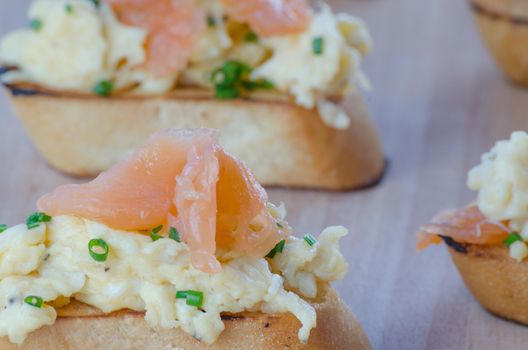 Toast with smoked salmon with scrambled eggs