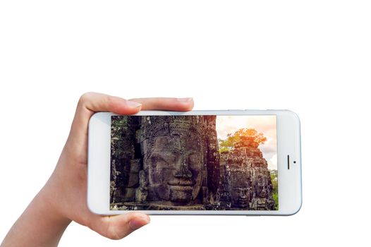Hand holding Smartphone with image of Angkor Wat Temple, Siem reap in Cambodia.