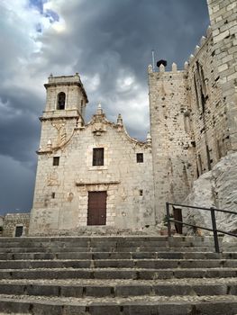 Medieval castle under dramatic sky. Castell de Peniscola, in the province of Castellon, Valencian Community, Spain.