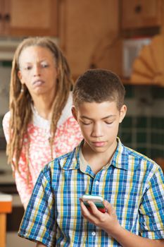 Mother attempts to peek as teen son checks his mobile phone