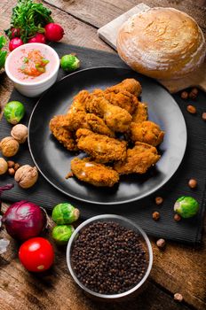 Spicy breaded chicken wings with homemade bread