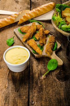 Corn crusted Chicken Tenders with spinach and toast, honey-dijon mustard dip, homemade bread baguette