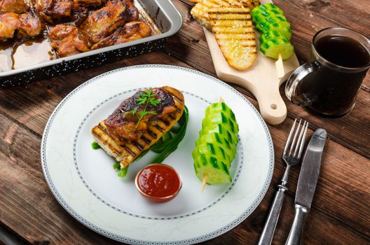Sticky chicken with spicy sauce, toasted panini with coarse-grained salt and olive oil plus cucumber kebab